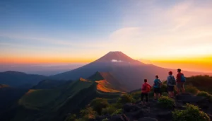 Hikers overlooking Mount Rinjani at sunrise with vibrant colors and mountain scenery